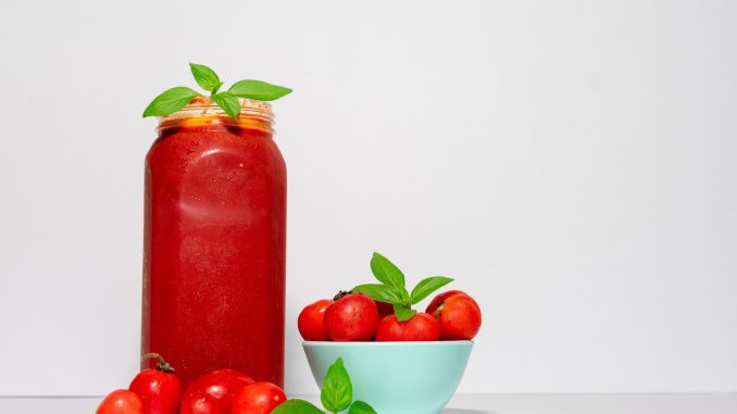 red tomato with jar